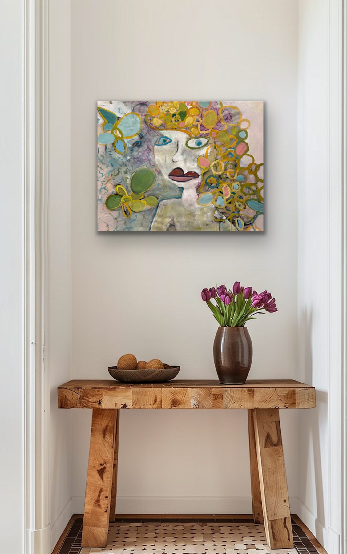 Artistic portrait above rustic wooden table with flowers and bowl.
